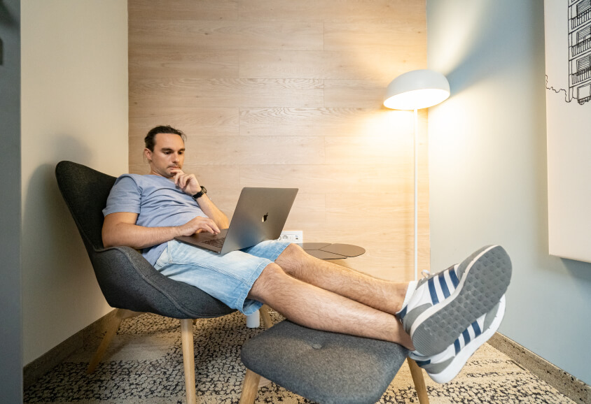 man working on mac seated