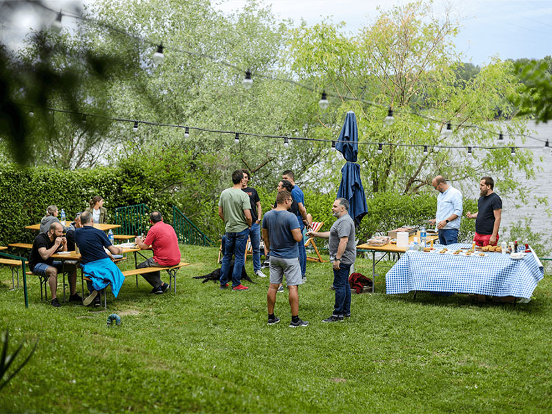 people enjoying barbecue outdoors